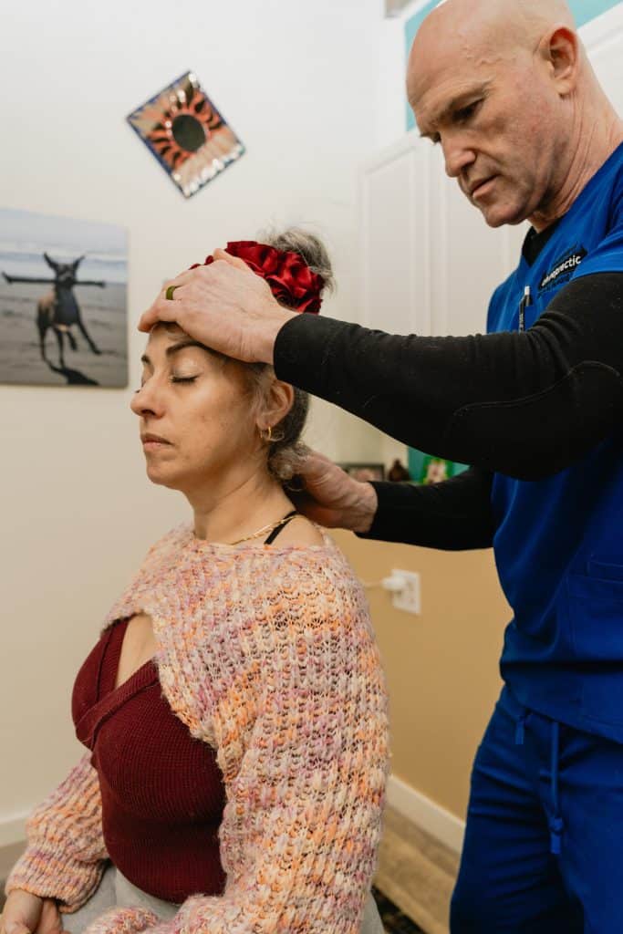 same-day chiropractor in Tulsa performing neck adjustment Midtown walk-in clinic