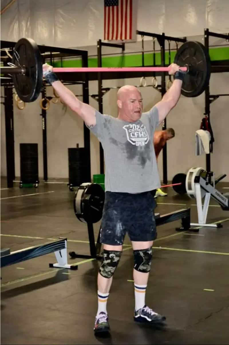 Shoulder pain chiropractor in Tulsa Dr. Jason Forward training overhead press at CrossFit Jenks